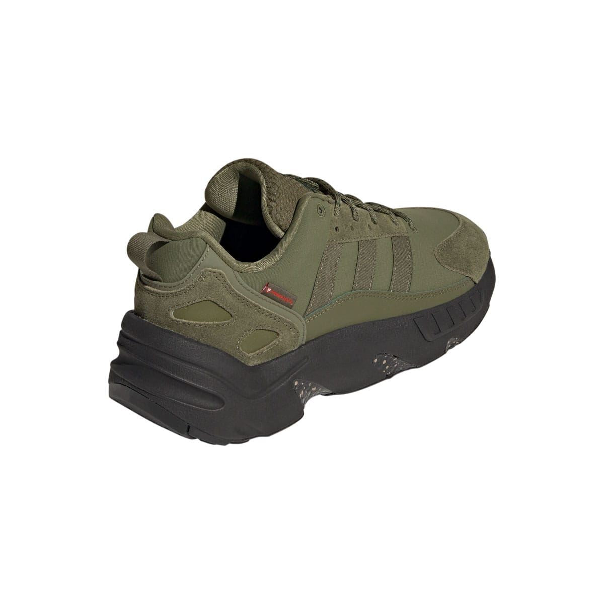 Olive low-top trainers with heel tab, lace-up front, and chunky dark midsole