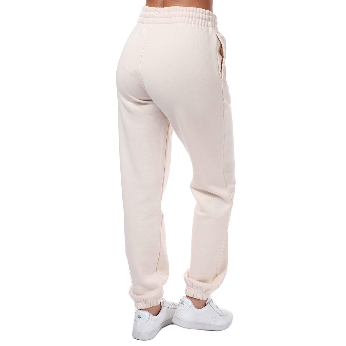 adidas Originals womens Adicolor Essentials fleece joggers, soft grey track pants with elastic waistband and relaxed fit.