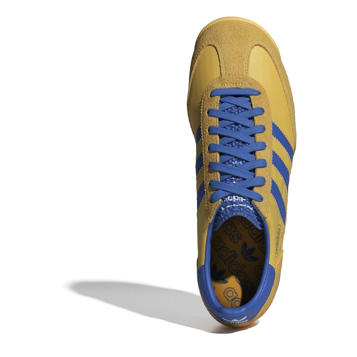 adidas Originals low top sneaker, gold upper with blue laces and stitched Three Stripes