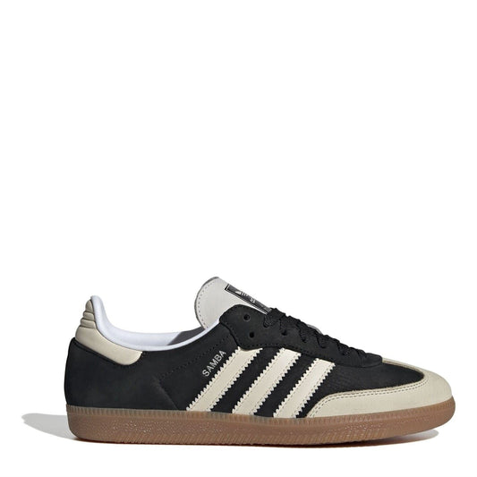Black and beige low-top sneakers with three white stripes and gum sole