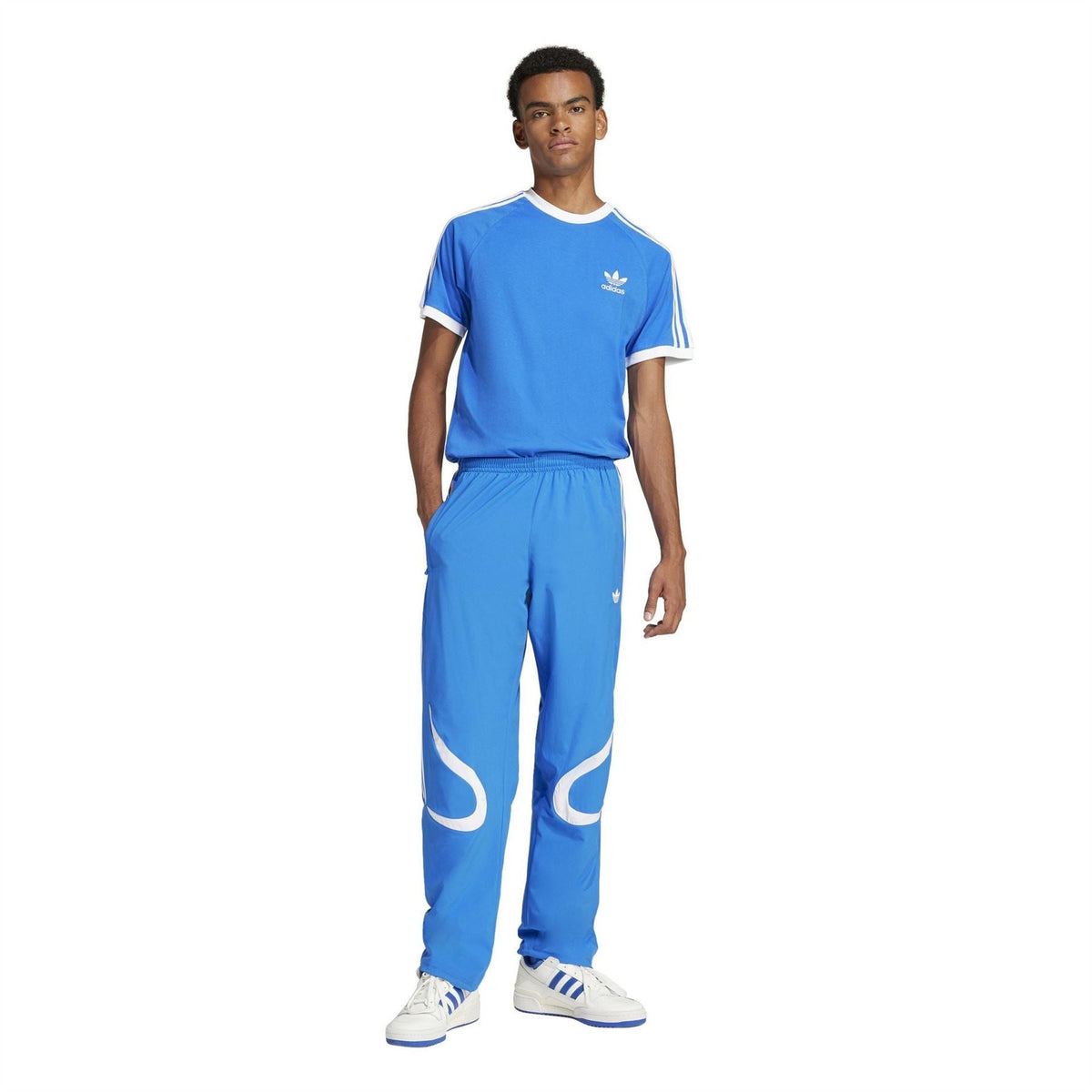 adidas Originals blue track pants with white side graphic and elastic waist