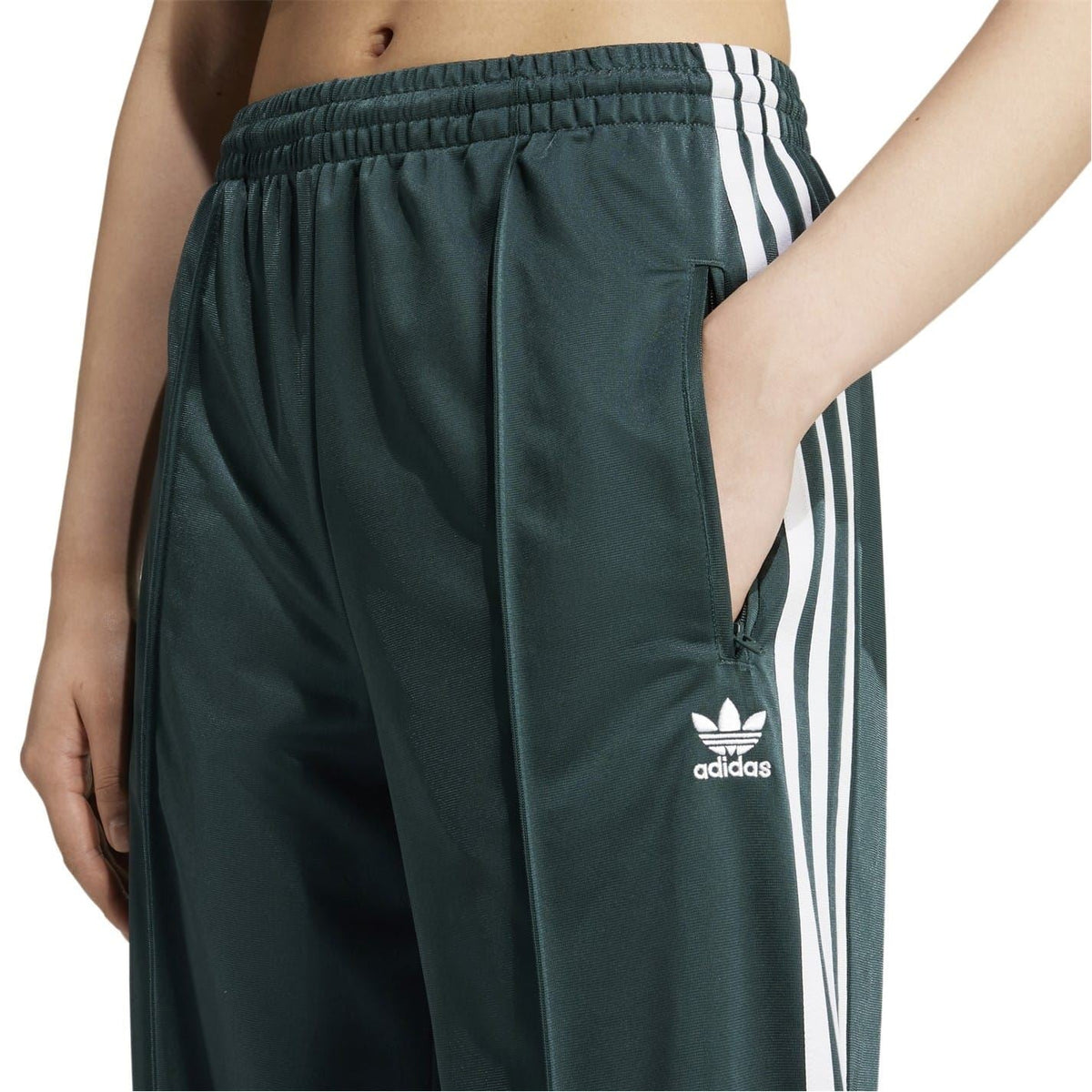 adidas Originals dark teal track pants with elastic back waist and adidas logo on leg
