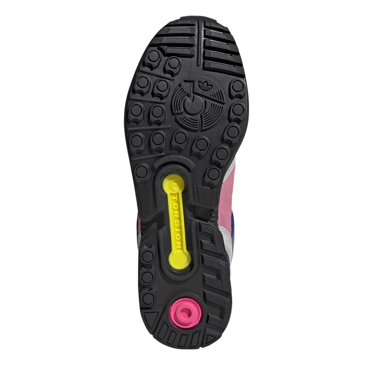 Rubber outsole with deep tread and circular traction pods, black with pink and yellow