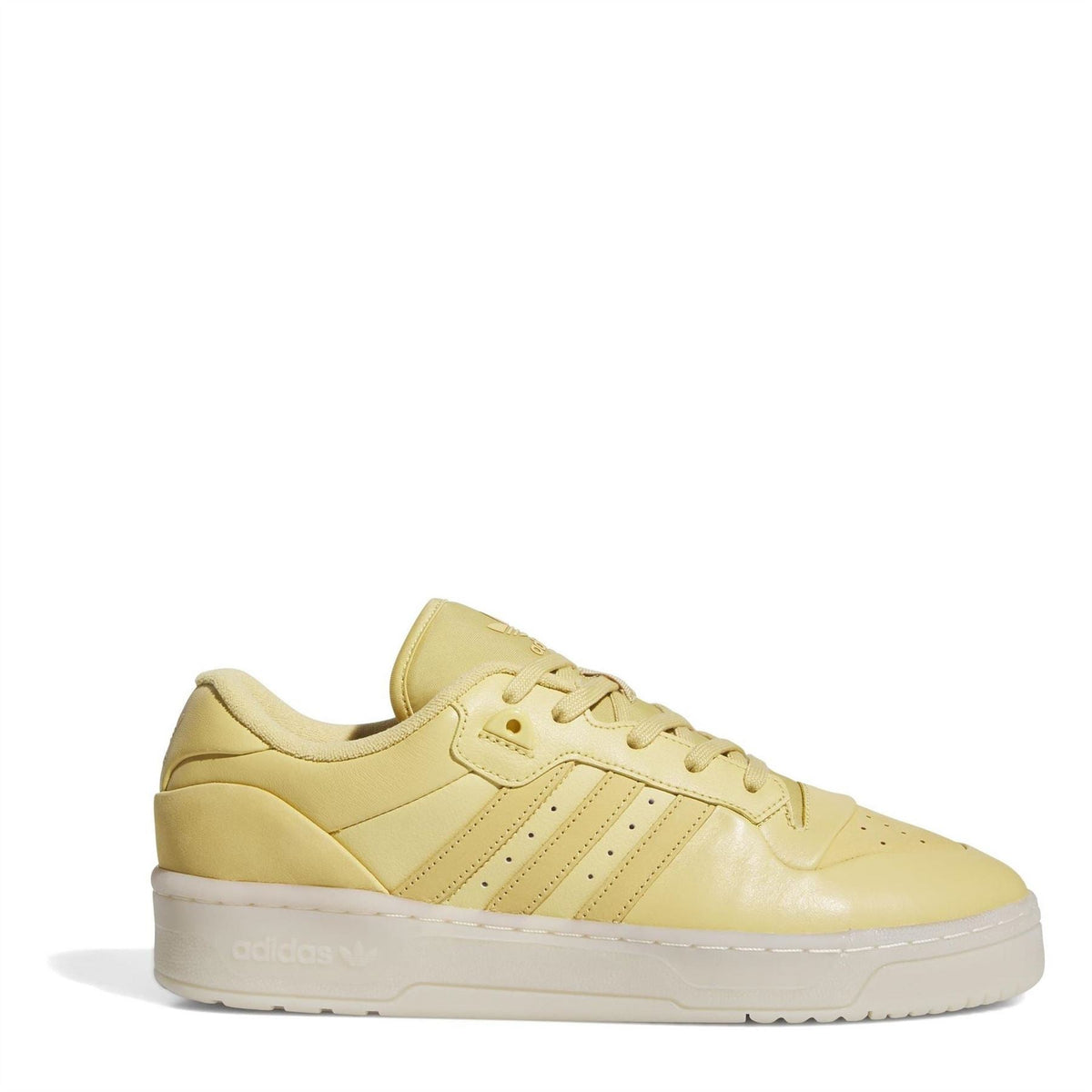adidas Rivalry low-top flatform sneaker, yellow leather upper with three stripes