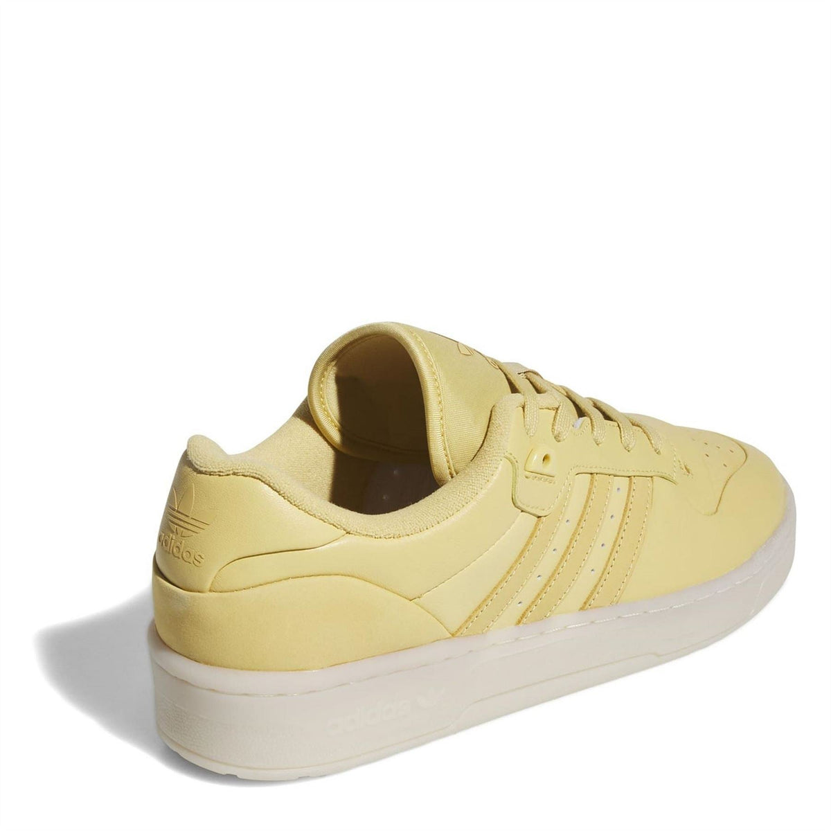 adidas Rivalry low-top flatform sneaker, heel and side view in yellow with platform sole