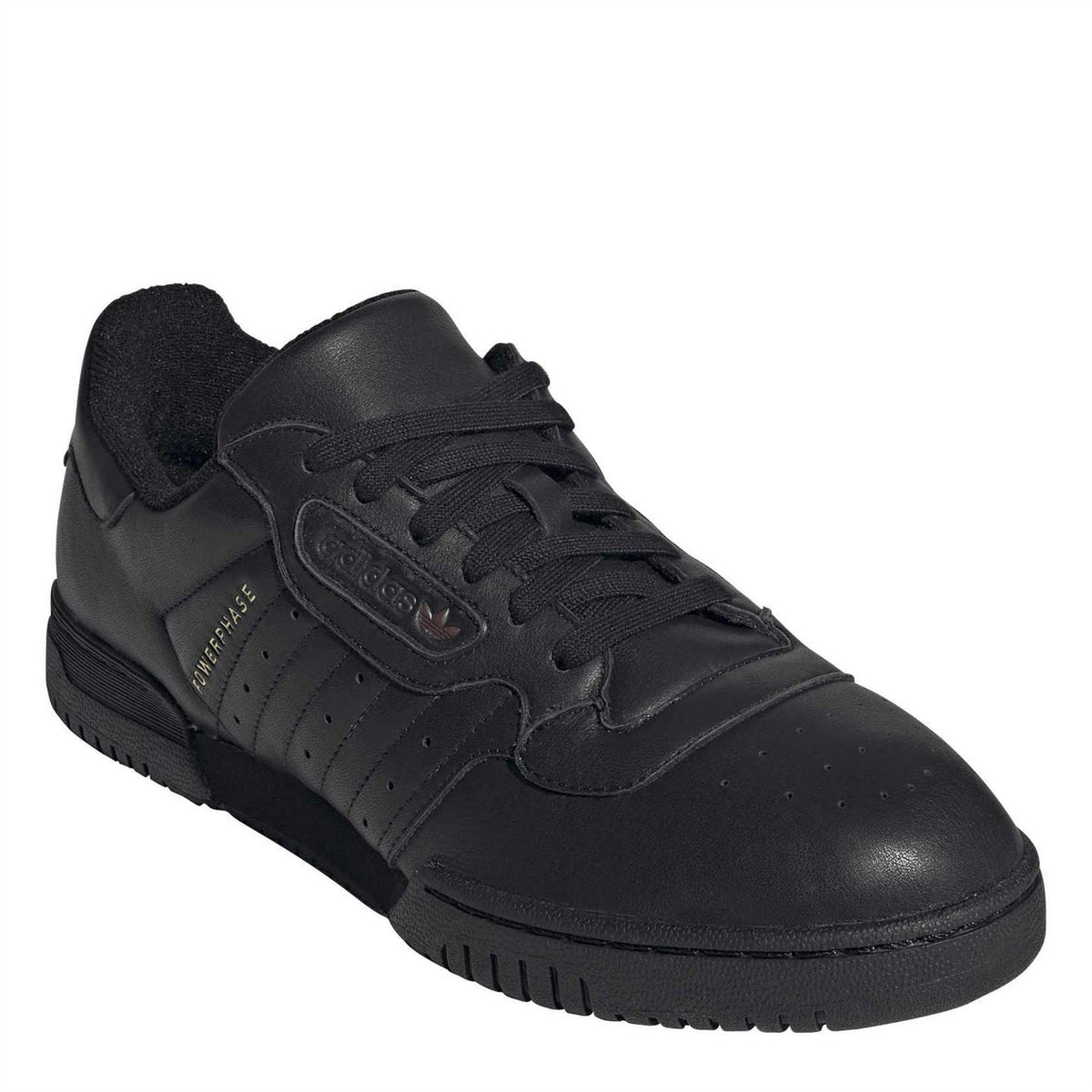 Black Powerphase-style low-top sneakers with lace-up front and embossed logo