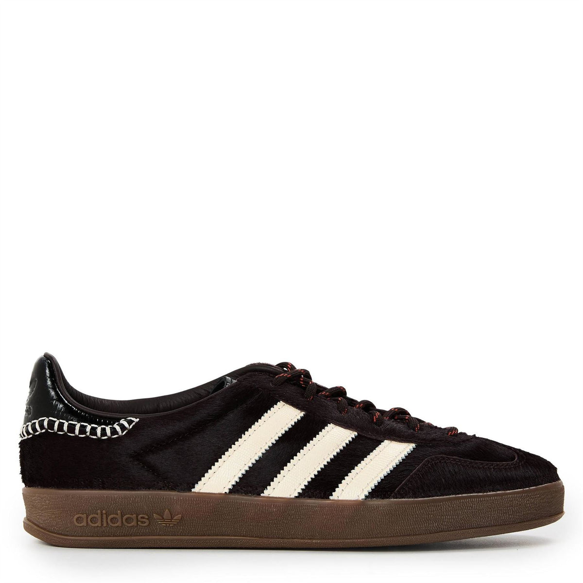 Black suede-look Gazelle pony shoes with white three stripes, brown gum sole, lace-up.