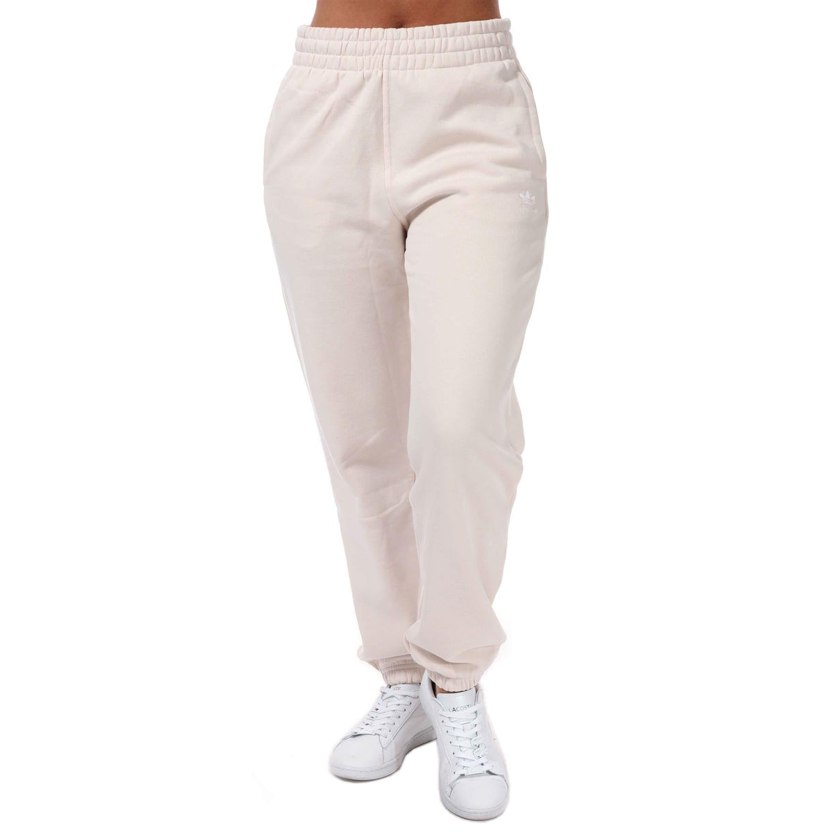 adidas Originals women's Adicolor Essentials fleece joggers, soft track pants with a relaxed fit and elastic waistband, in a cozy fleece fabric.