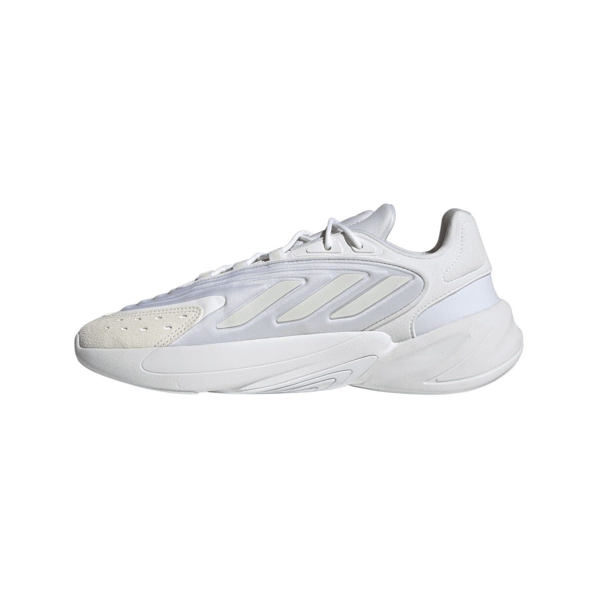 White adidas Ozelia trainers with lace-up upper and molded overlay stripes