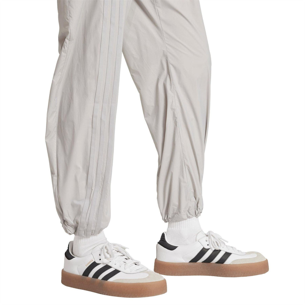 Light grey joggers with vertical seam detailing and elasticated ankle cuffs