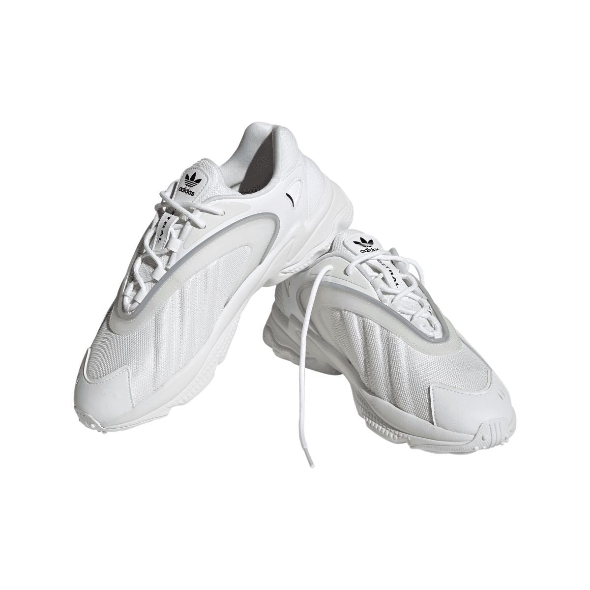 White adidas Originals Oztral trainers, angled view with laces and woven-look upper