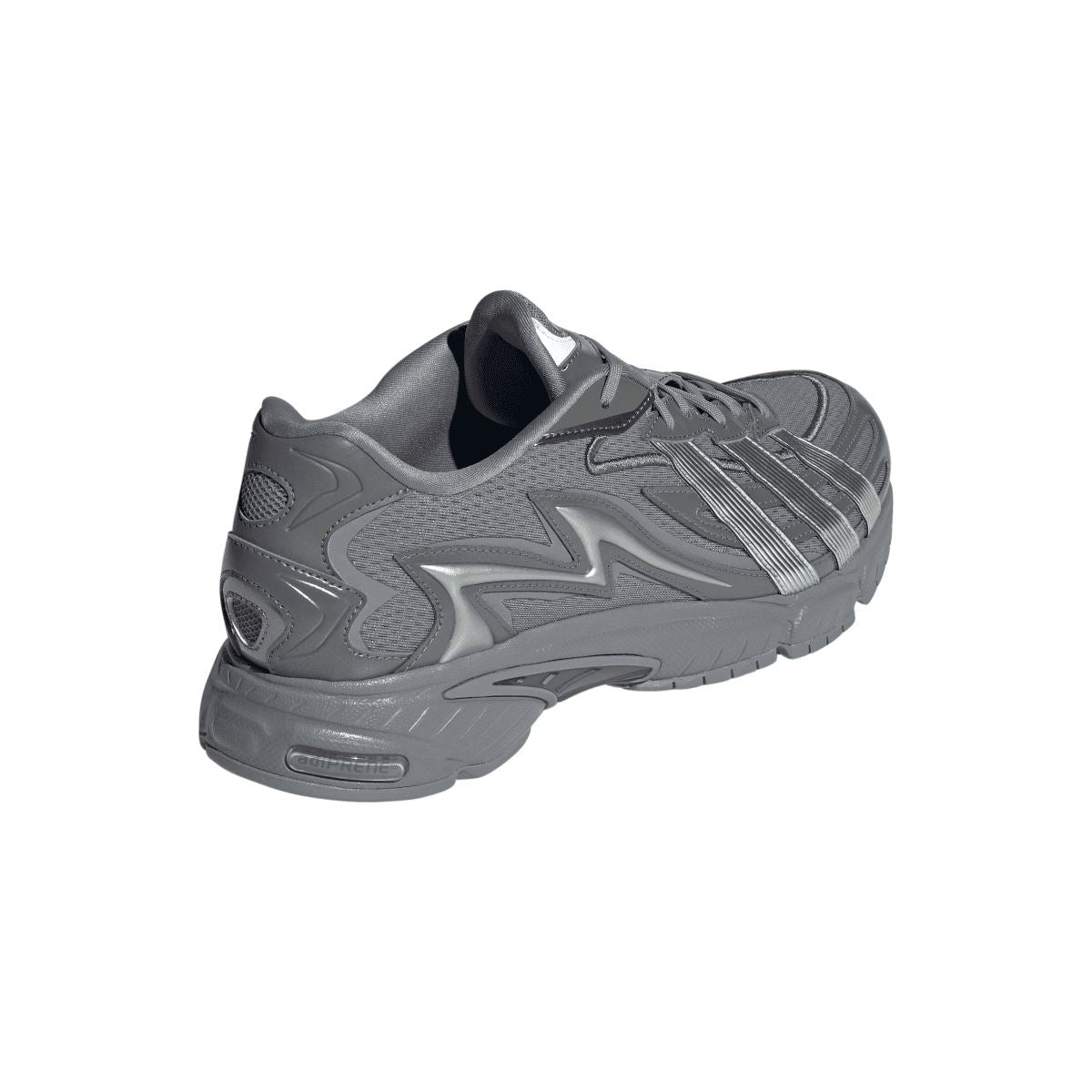 Grey adidas lace-up trainer from side-rear angle with silver stripe accents