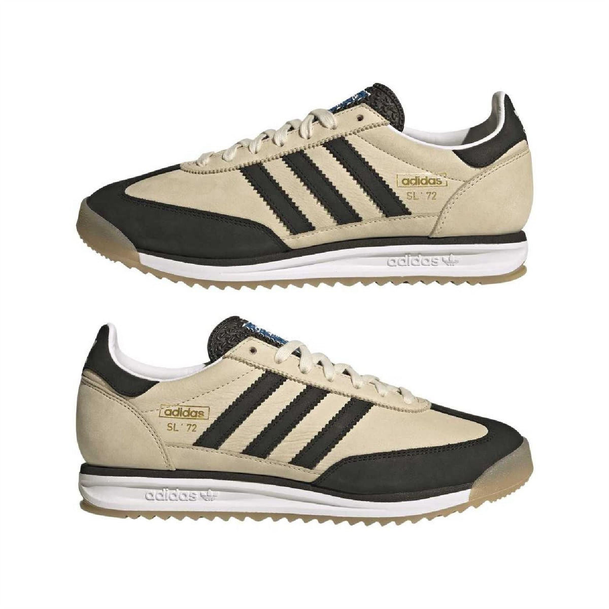 Pair of beige and black adidas low-top sneakers with three stripes and lace-up closure