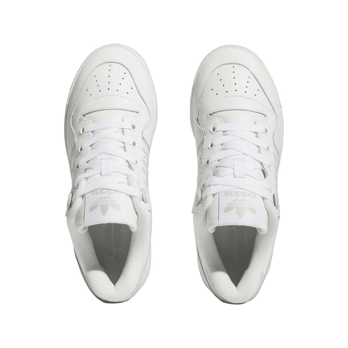 Pair of white lace-up trainers with perforated toe box and padded collar