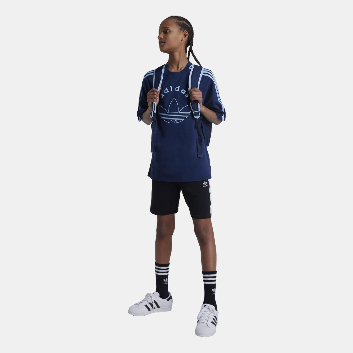 Kids wearing adidas Originals Adicolor shorts, junior clothing for ages 8-16, featuring the classic adidas logo and colorful design.
