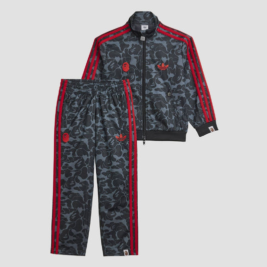 Kids camo tracksuit jacket with red zip, triple sleeve stripes, and ribbed cuffs
