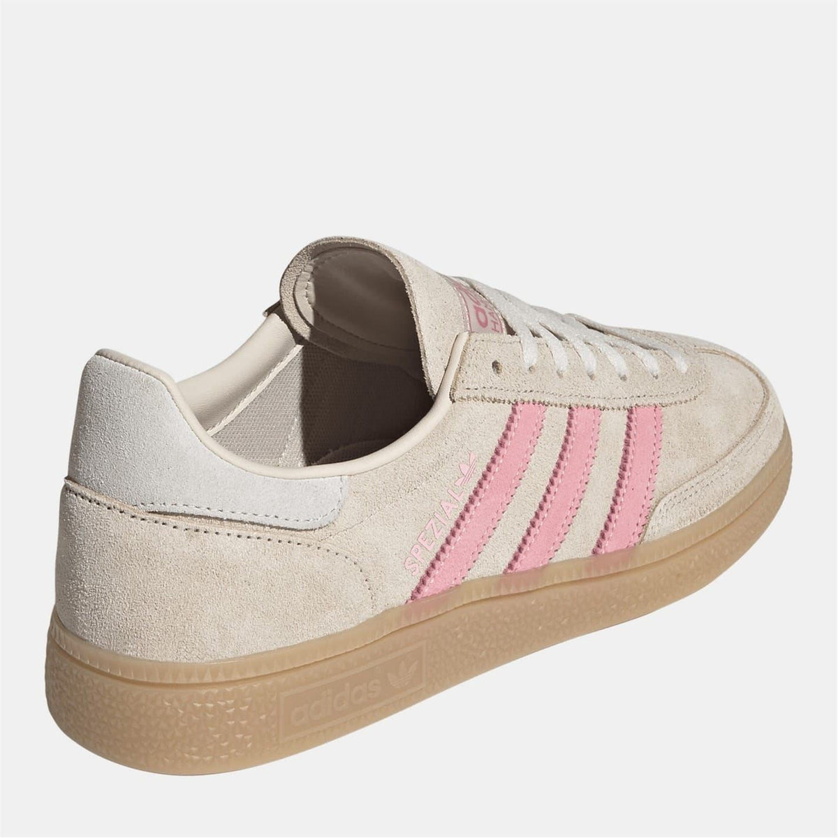 Beige suede women's low-top sneakers with pink side stripes and cushioned heel collar.