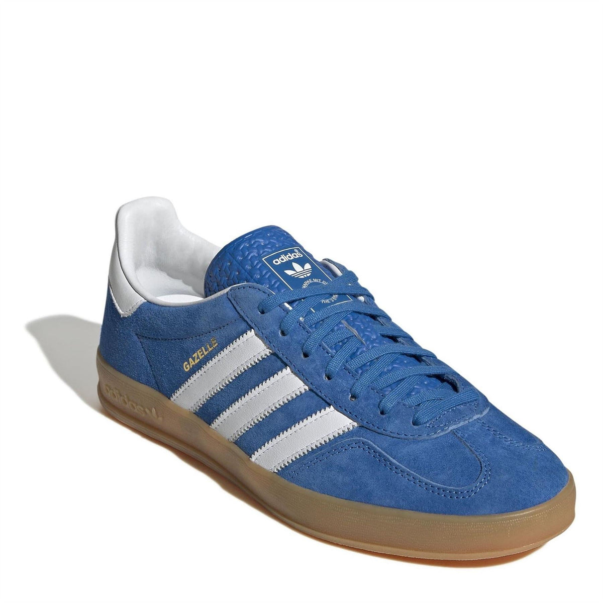 Blue suede lace-up sneaker with white stripes, gum sole, and white sock liner