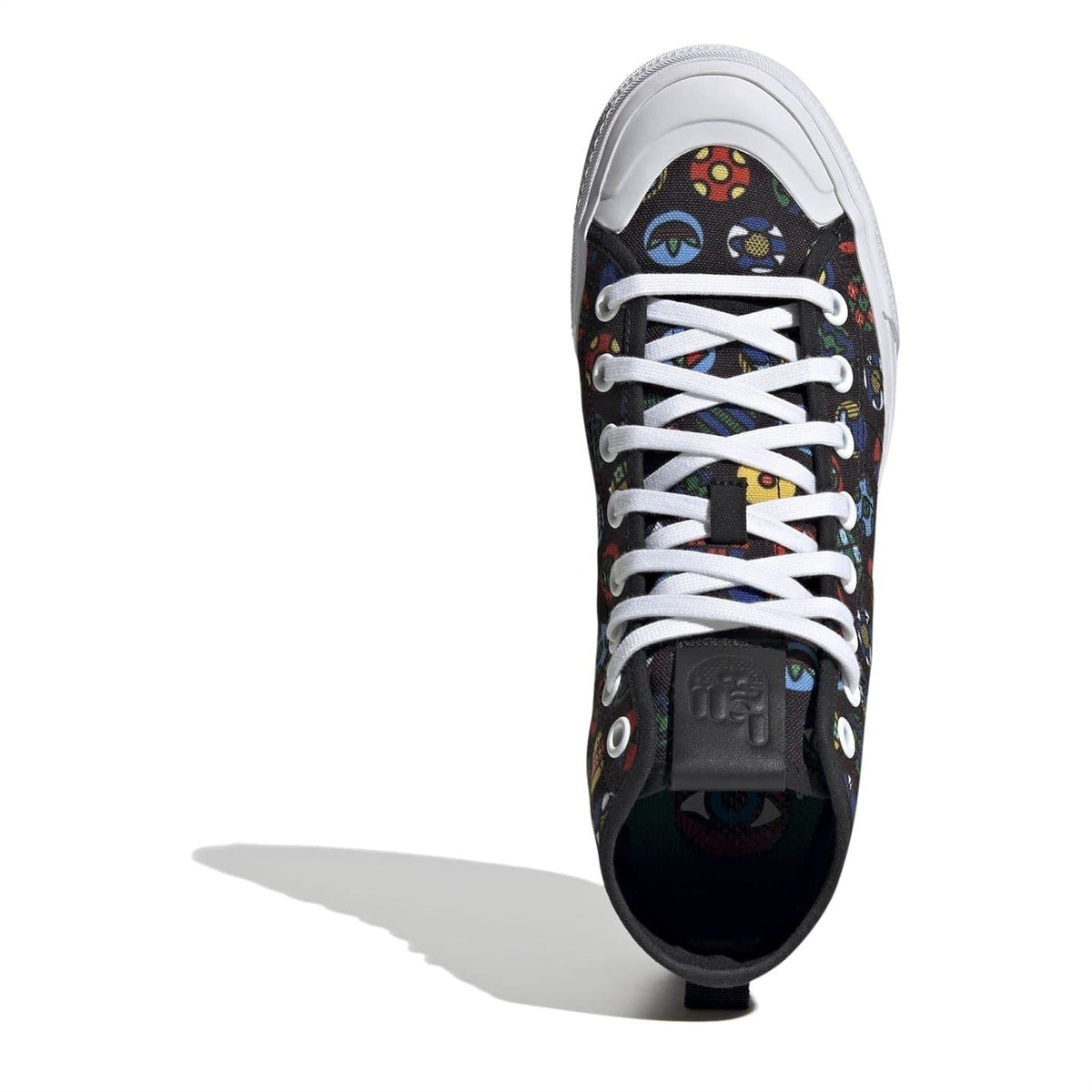 Front view of black hi-top sneakers with multicolor eye-and-icon print and white laces.