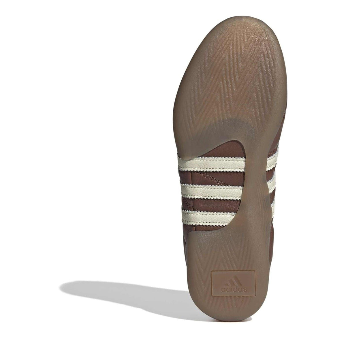 Brown adidas Originals low top sneakers heel view with cream three-stripe accents.