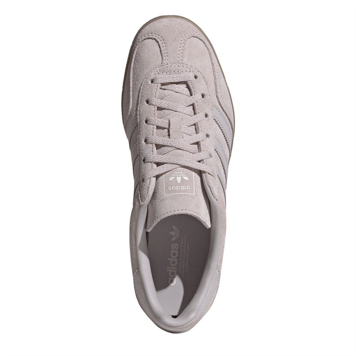 Front view of light suede lace-up trainers with adidas logo on tongue.