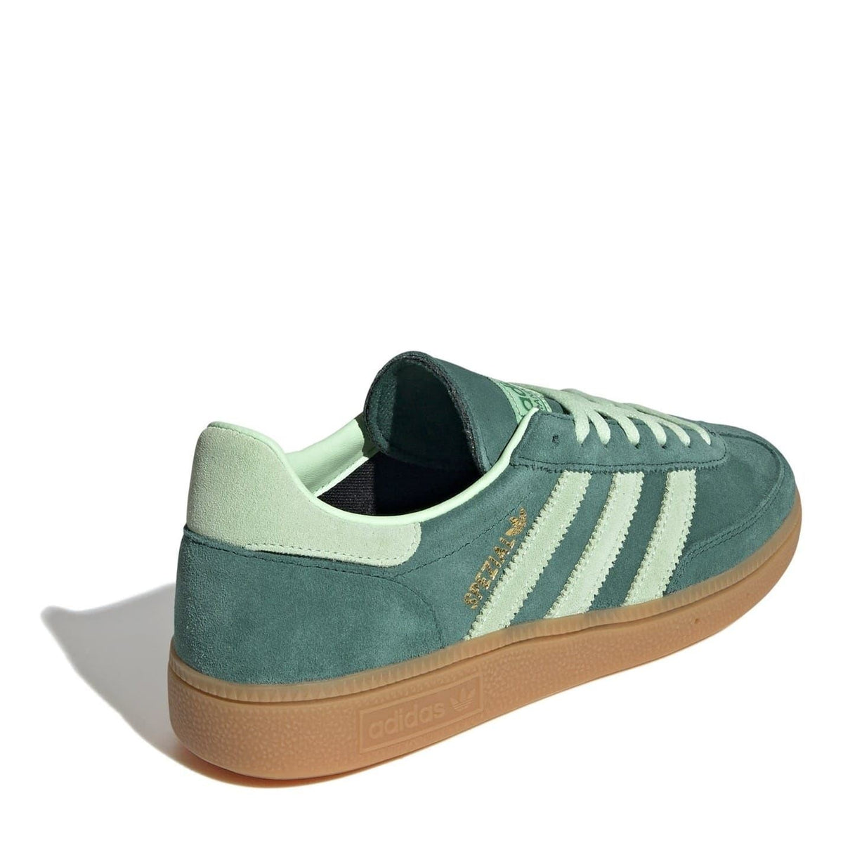 Green low-top sneakers with mint lining, three-stripe detail, gum sole