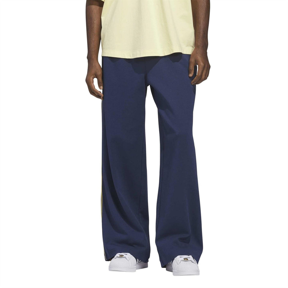 adidas Originals men’s woven joggers in dark blue, wide straight leg, elastic waistband