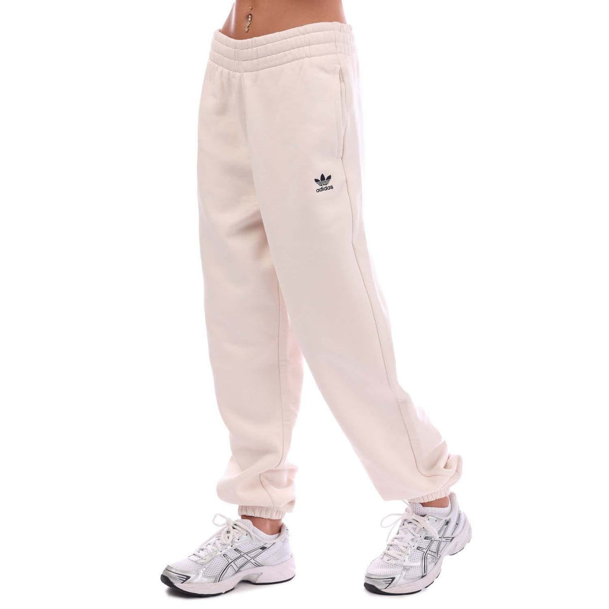 Off-white fleece joggers with side seam and small adidas logo on leg