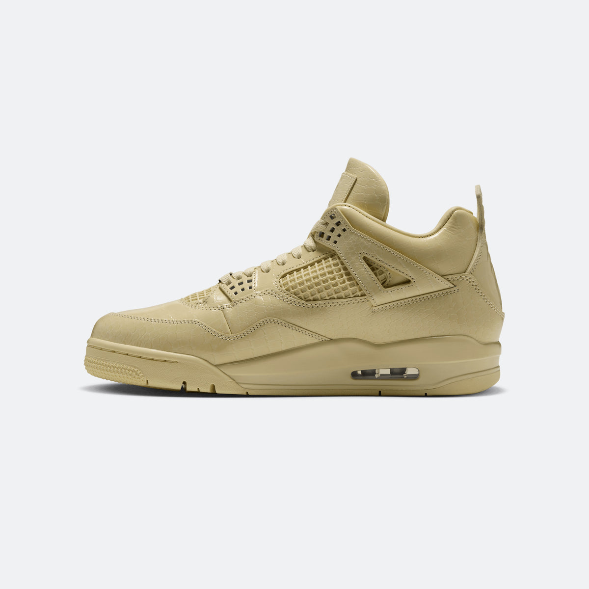 Yellow low-top sneaker with perforated overlays and visible air unit on midsole