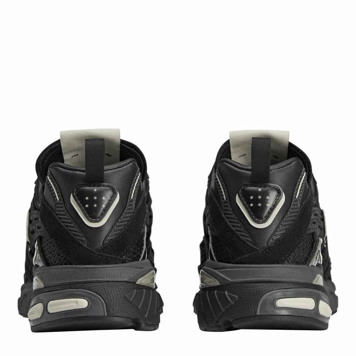 adidas Originals Cushion STFM Trainers showing black and white athletic footwear with cushioned soles and stylish design