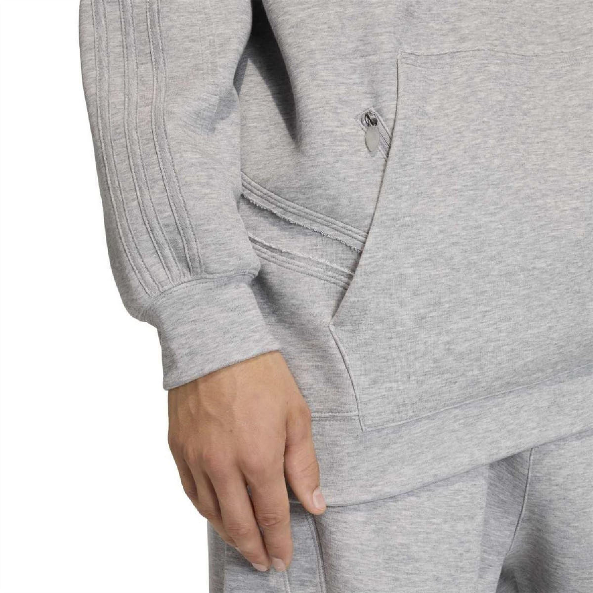 Grey hoodie sleeve and kangaroo pocket detail with ribbed cuff