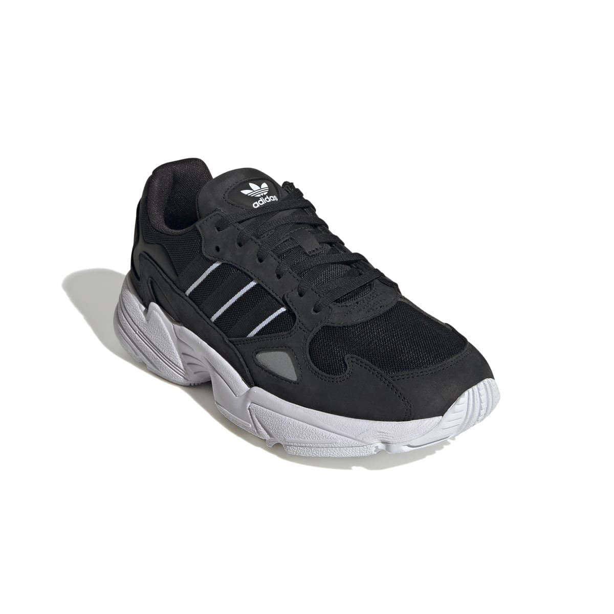 Black lace-up sneakers with mesh upper, three stripes detail, and white midsole