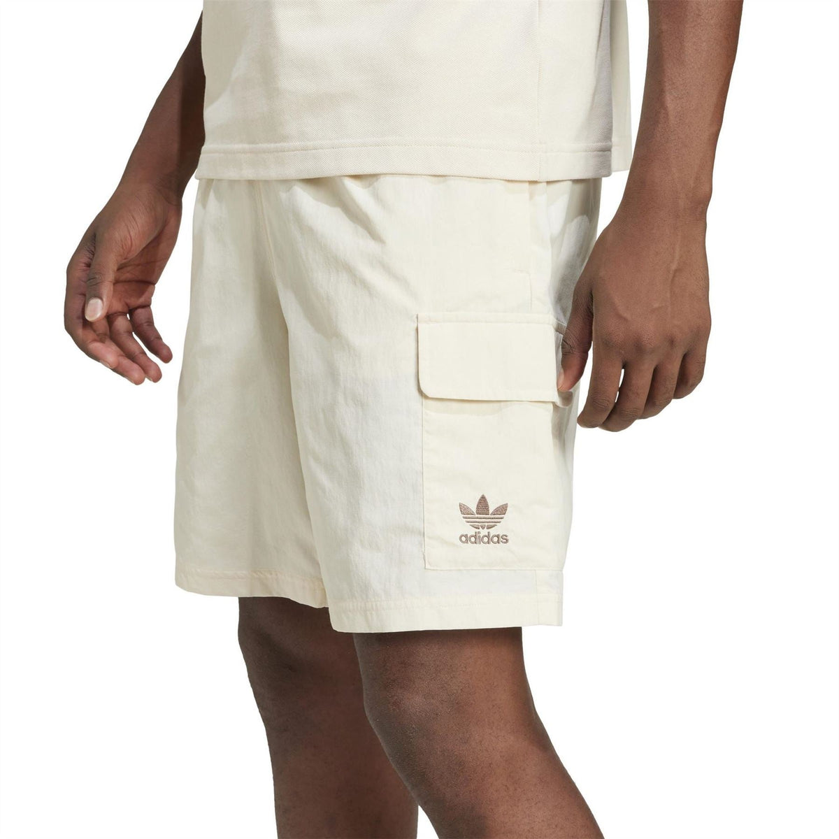 adidas Originals Essvn shorts in black with adjustable drawstring waist and iconic three-stripe design on the sides