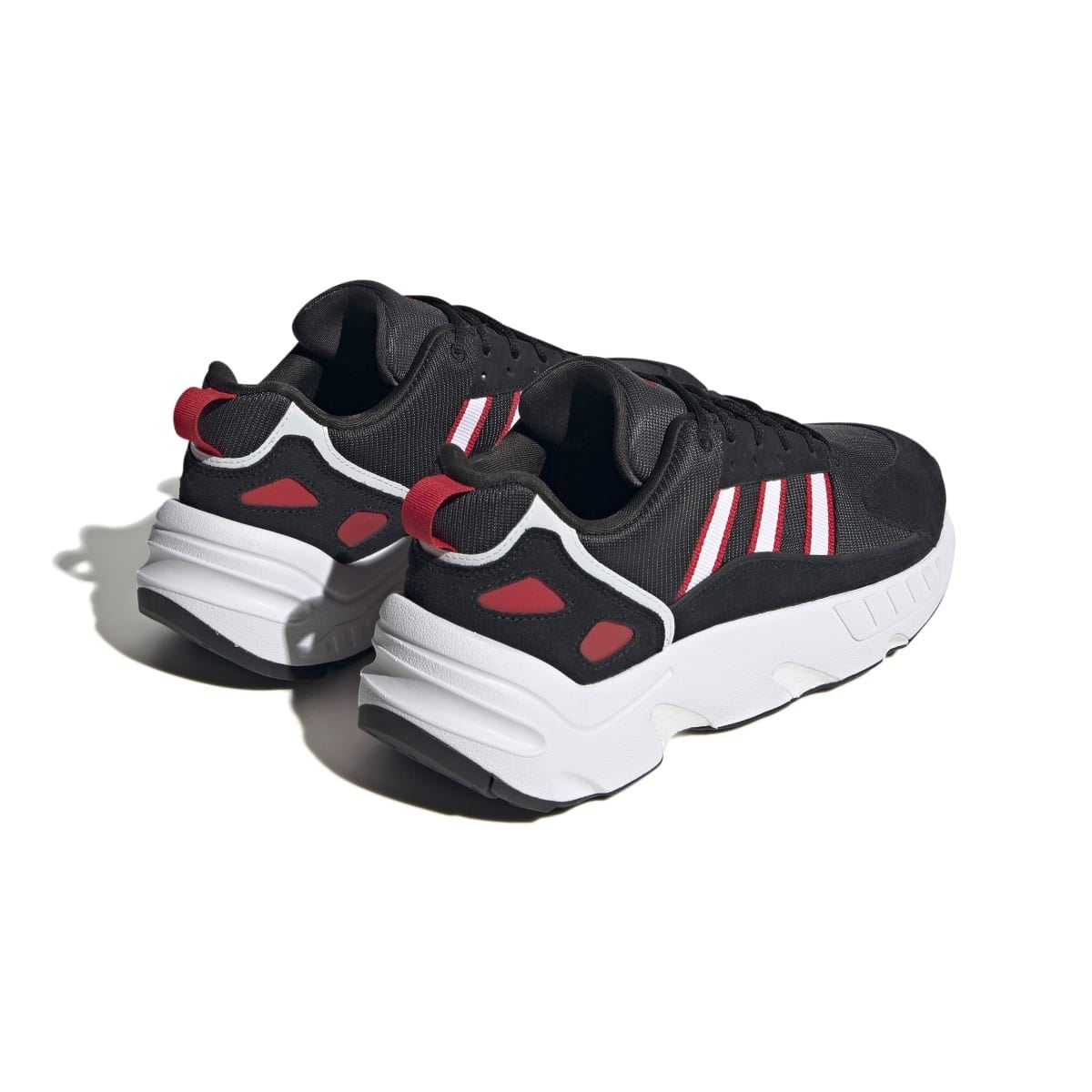 Rear side view of black ZX 22 Boost trainers with red accents and white cushioning sole