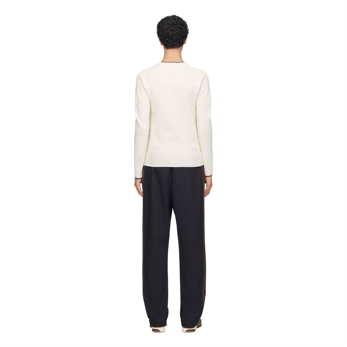 Cream knit long-sleeve crewneck top, back view, with navy and yellow cuff trim