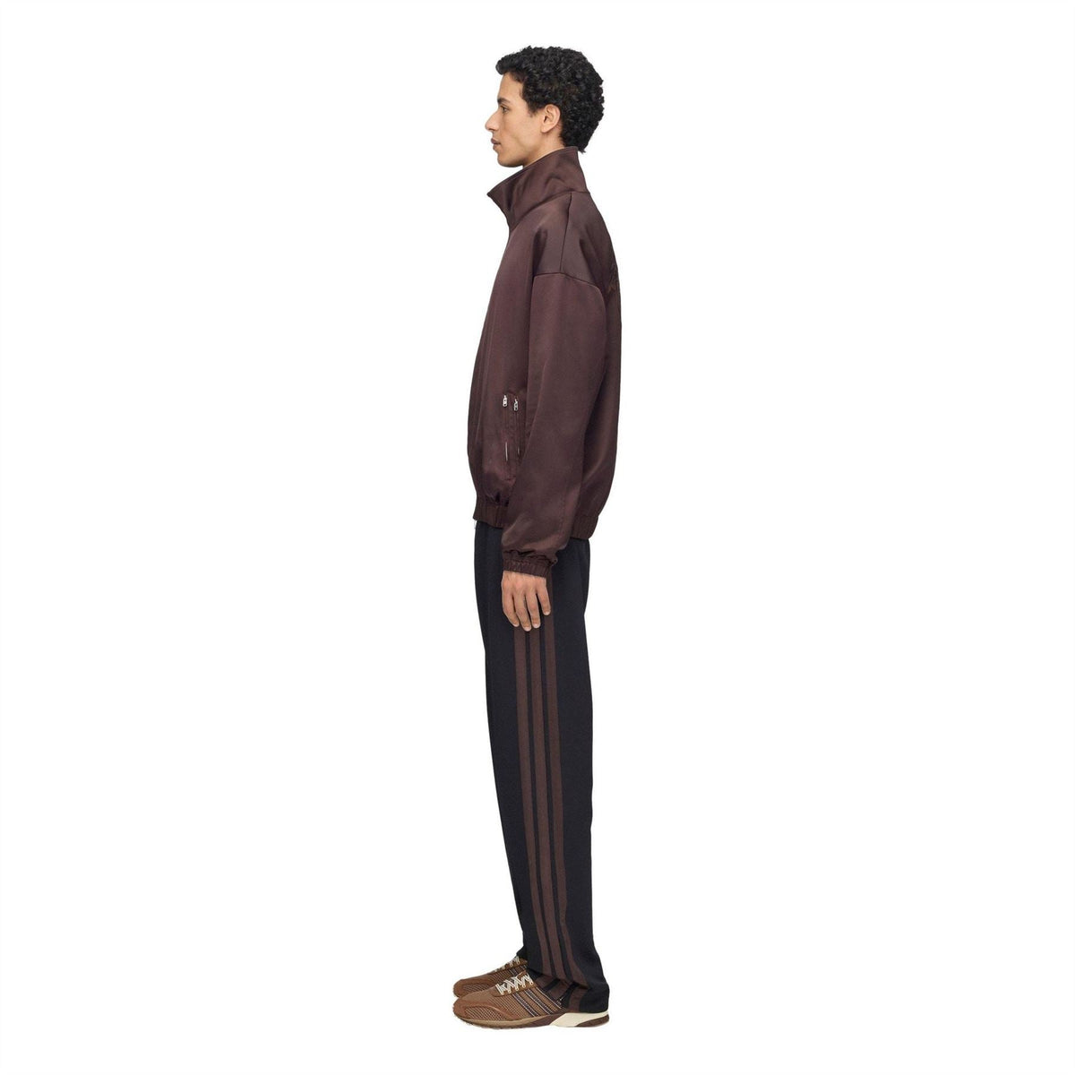 Black track pants with slim taper and side stripe panels