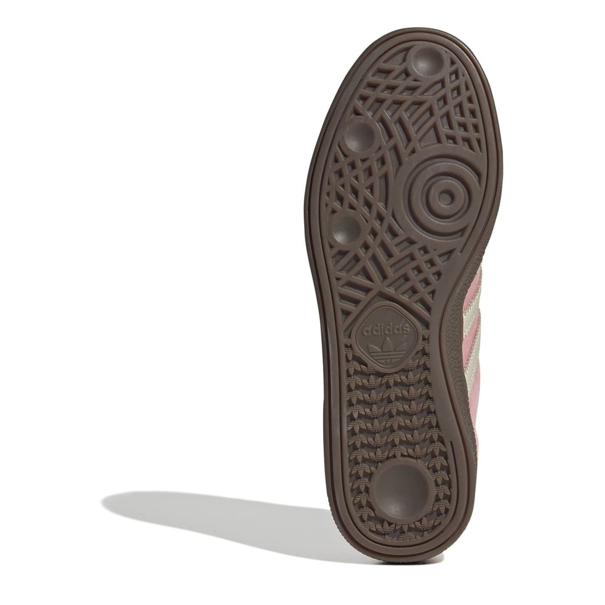 Dark brown rubber outsole with circular tread pattern and adidas trefoil logo