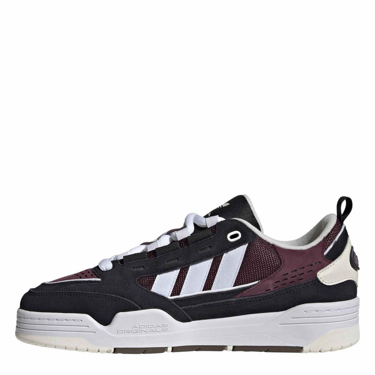Low-top trainers in black with burgundy accents and white side stripes, lace-up