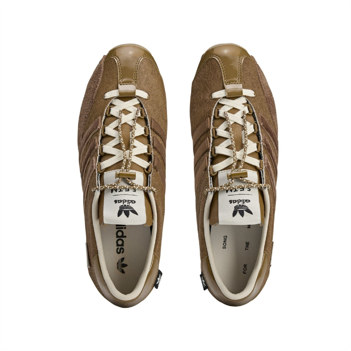 Pair of adidas Originals bronze sneakers, top view of laces and tongue labels