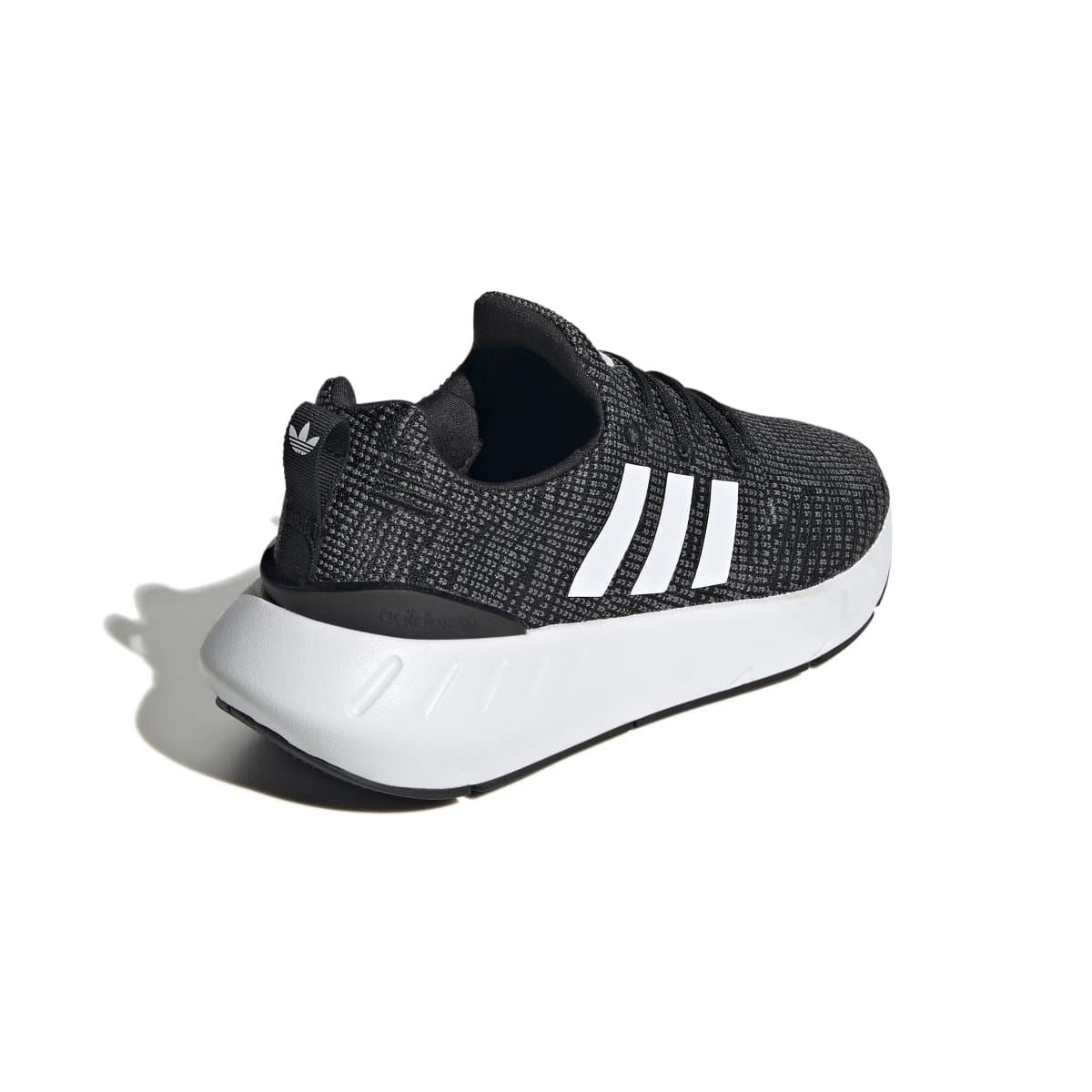 Junior adidas Swift Run 22 trainers, heel side view with black knit, white 3-Stripes, cushioned sole.