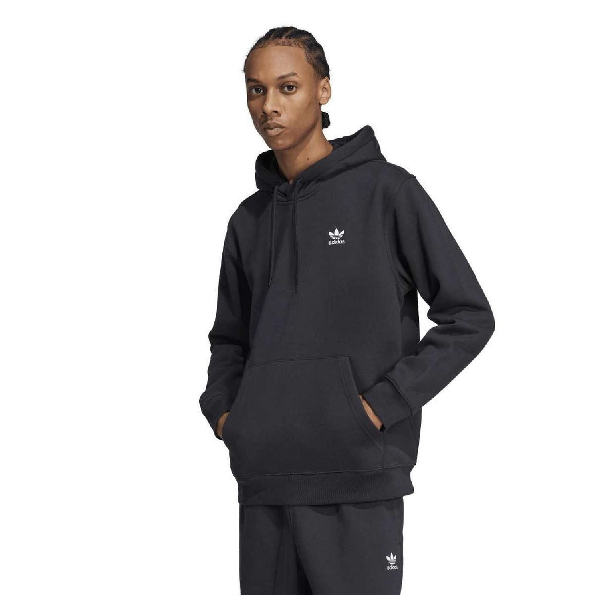 Black adidas Trefoil loose hoodie on model, drawstring hood and kangaroo pocket