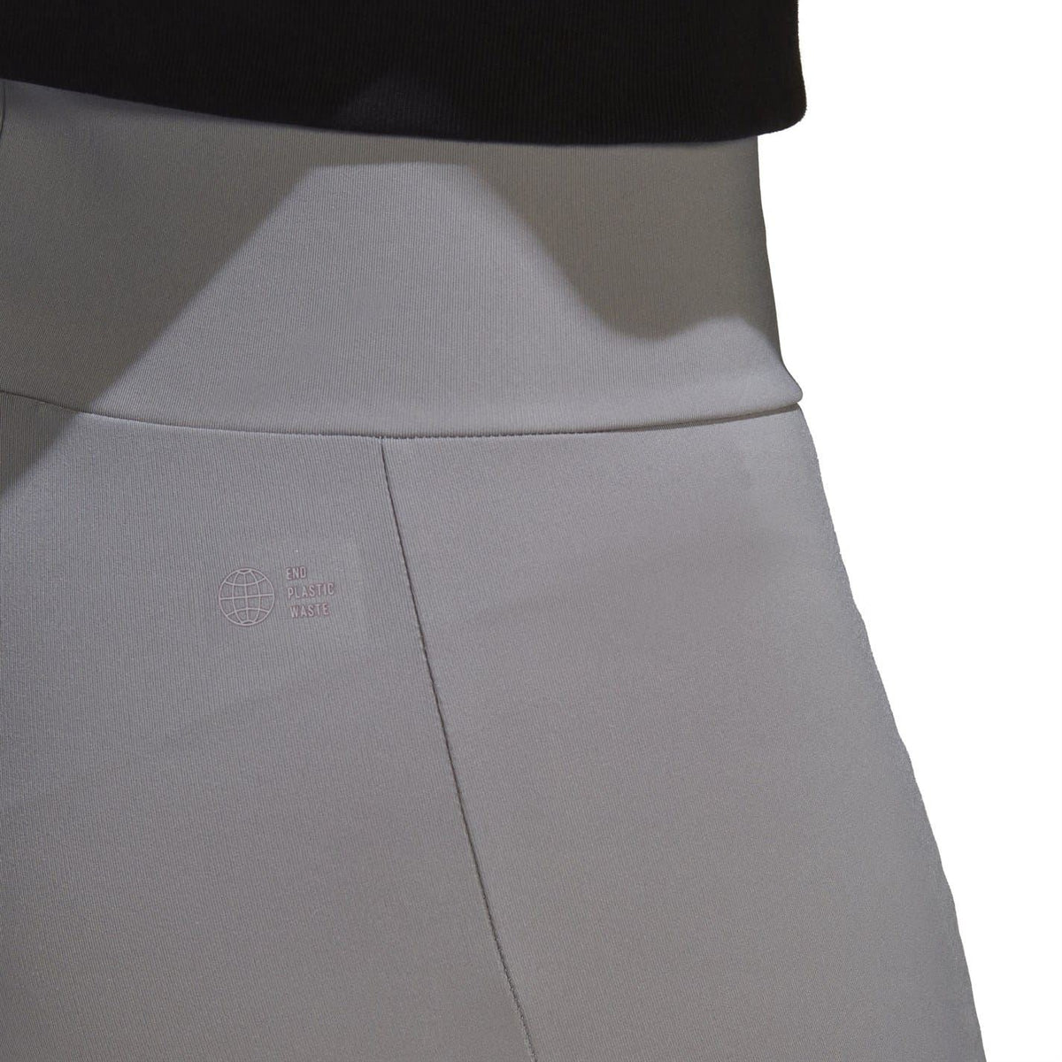 Light gray short leggings showing stitched seam and small logo at side