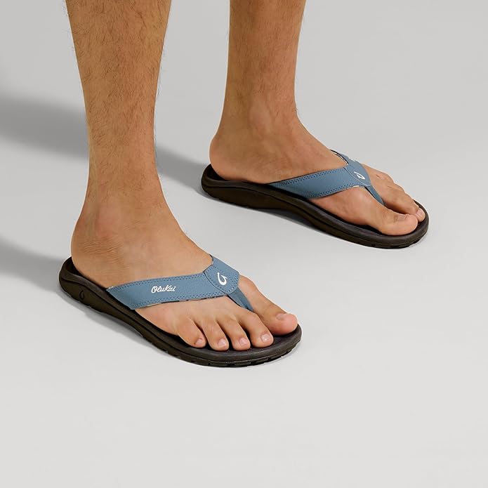 Blue thong flip-flop sandals with black rubber sole and logo strap