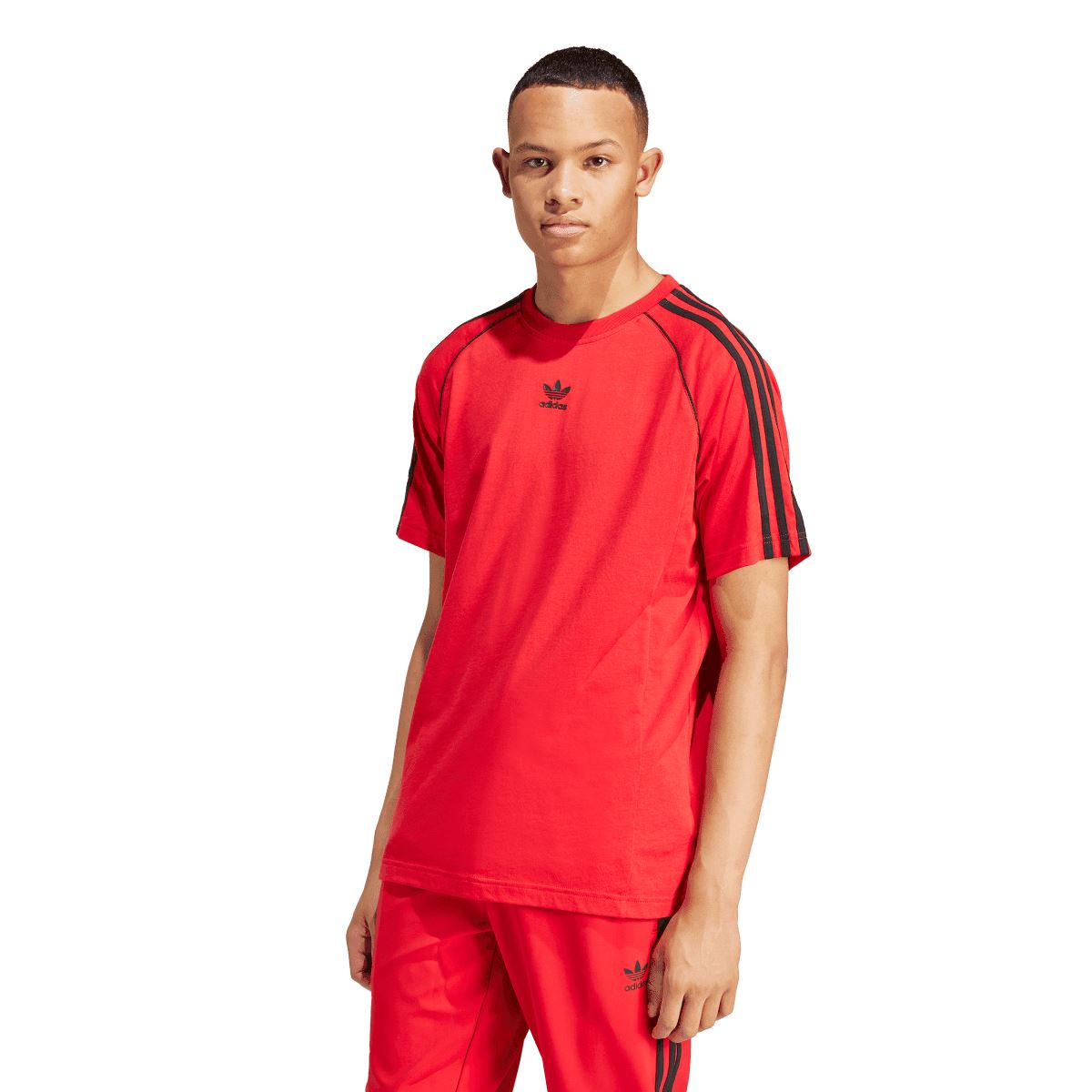 Red adidas SST T-shirt with crew neck and black sleeve stripes, worn by model