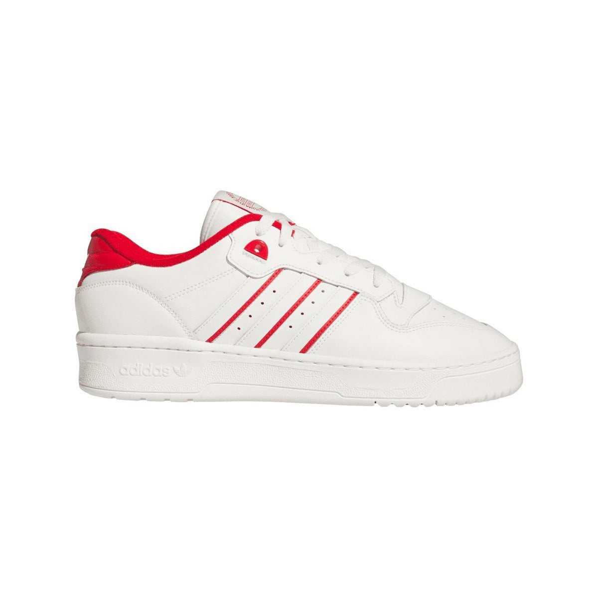 White low-top leather trainers with red stripe accents and lace-up front.