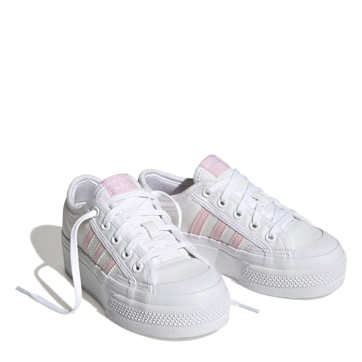 Pair of kids' white platform sneakers with pink triple stripes and laces
