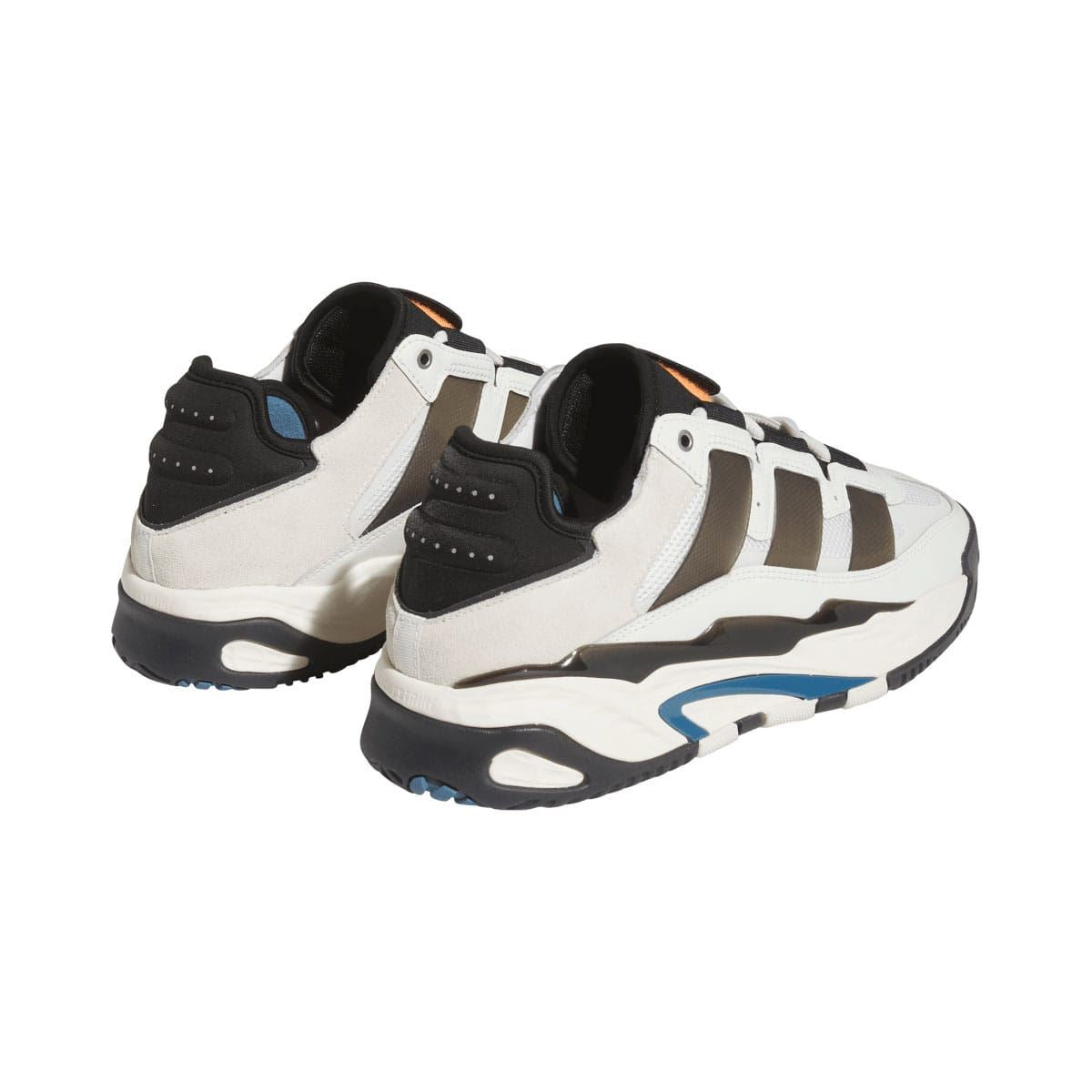 Niteball low-top sneakers, rear 3/4 view with black heel caps and orange pull tabs