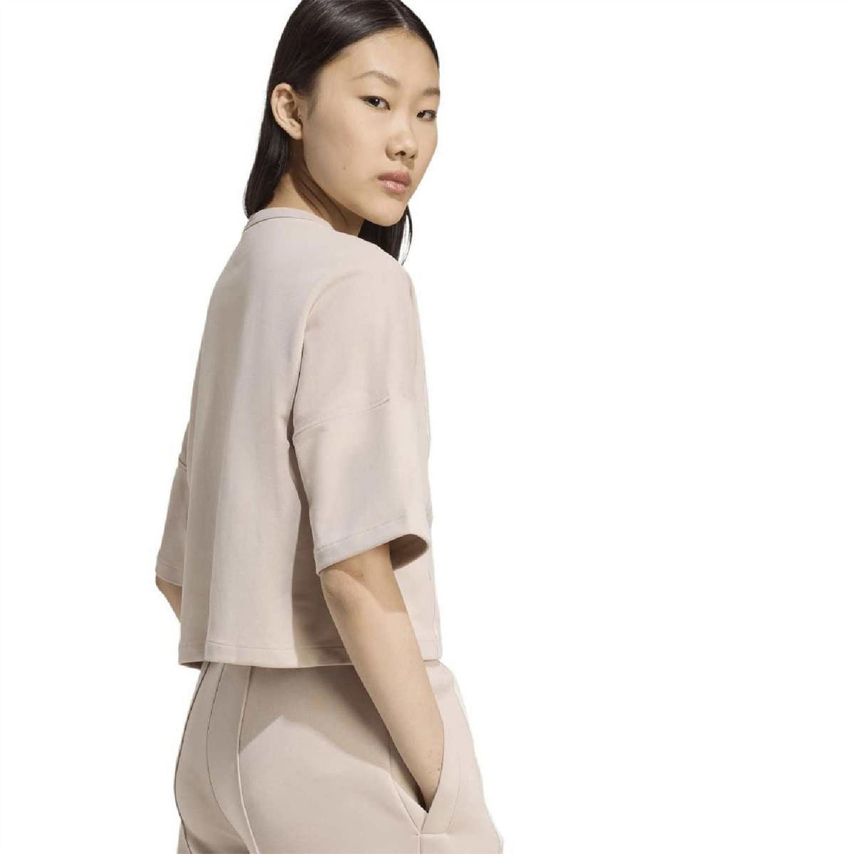 Light taupe crew-neck drop-shoulder t-shirt in side profile with vertical stripe panel