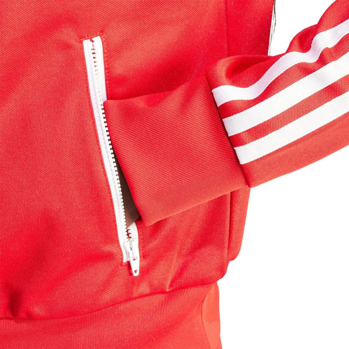 Red track top sleeve detail with white stripes and quarter-zip zipper pull