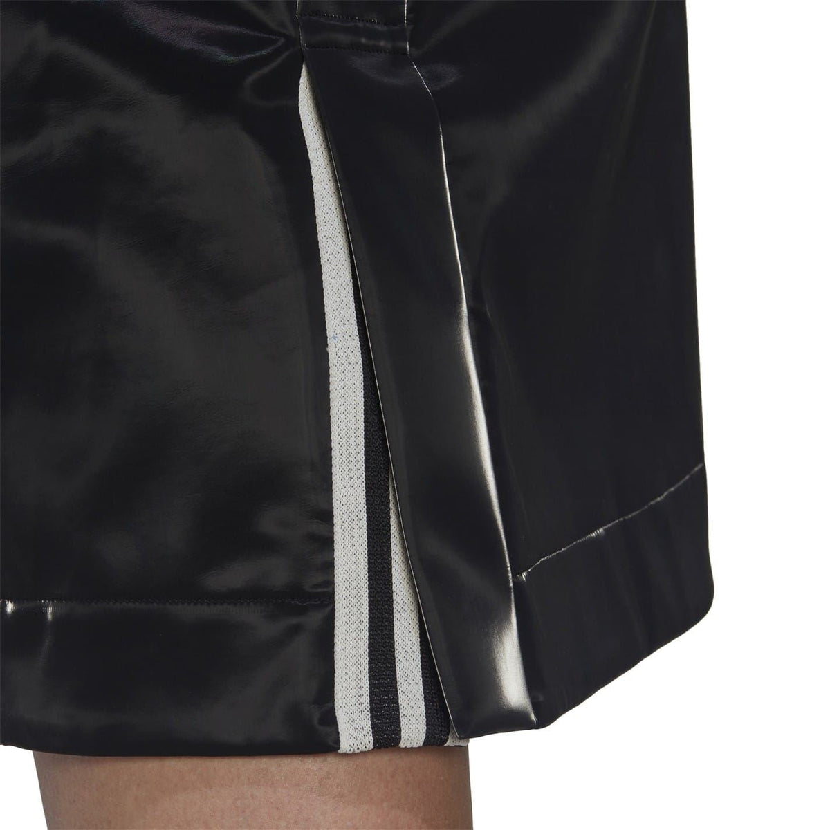 Black mini skirt with side stripe insert and visible zipper seam